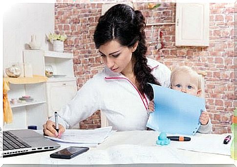 start studying again: woman holding child and trying to study