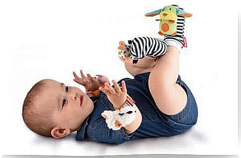 baby with toy socks