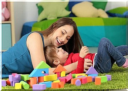 godmother and godchildren playing with blocks