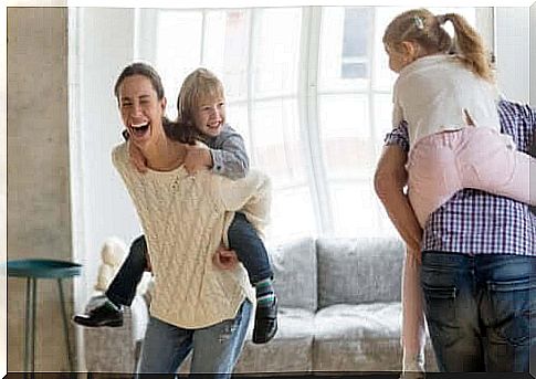 humor in the classroom: parents with children on their backs laughing