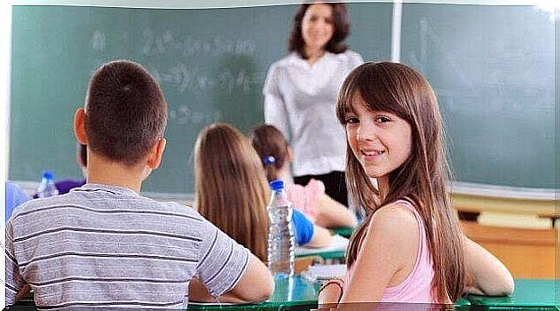 Girl looking into the camera in classroom