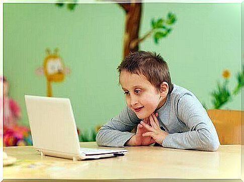 Children with special needs: boy looking at laptop