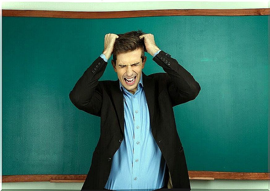 bad teachers: teachers in front of the blackboard are tearing their hair out