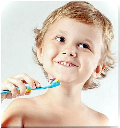 Boy brushes his teeth