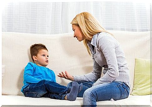 mom and son talking on sofa