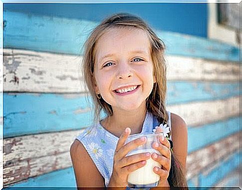 happy girl with milk glass