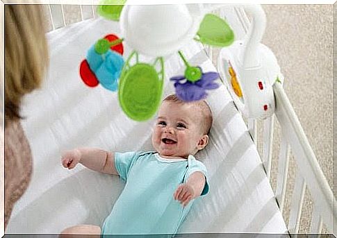 baby laughing at mobile