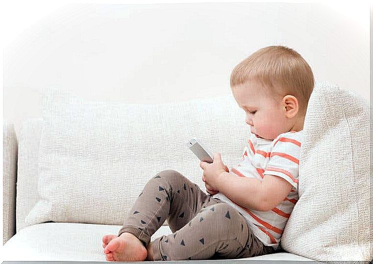 your phone is childproof: baby with mobile