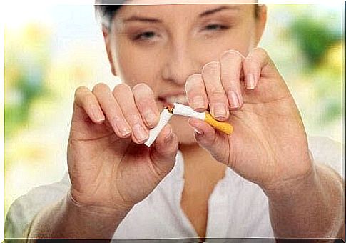 woman breaks cigarette