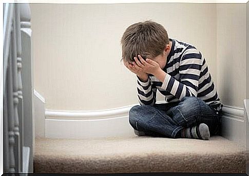 panic disorder: boy on the floor with head in hands