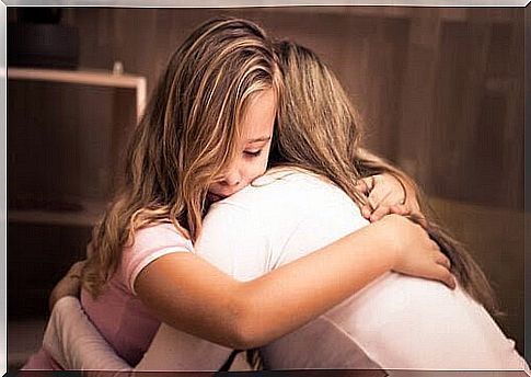panic disorder: mother hugs daughter