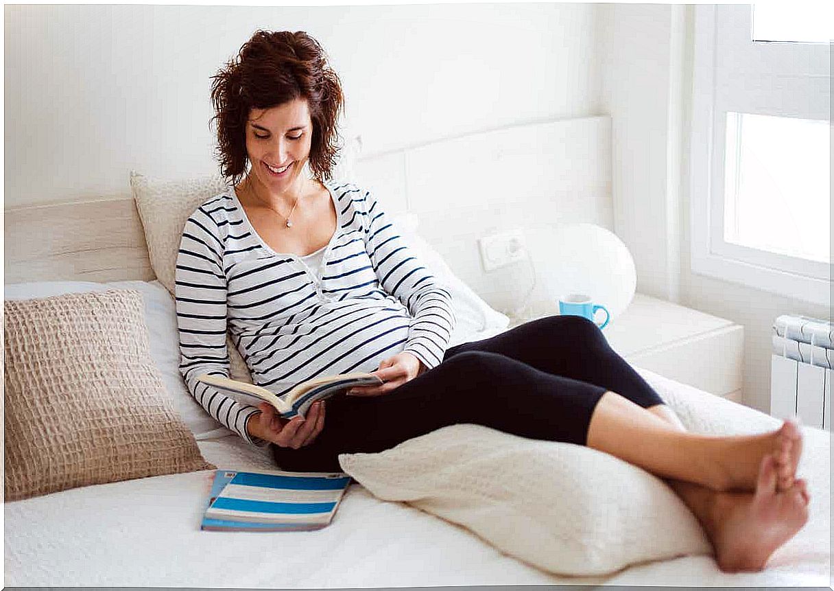 Pregnant woman reading.