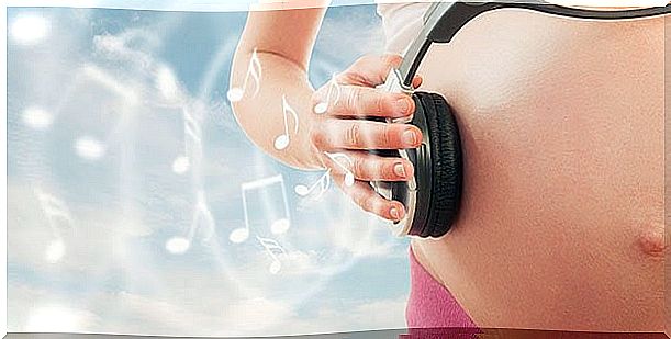 pregnant belly with headphones on