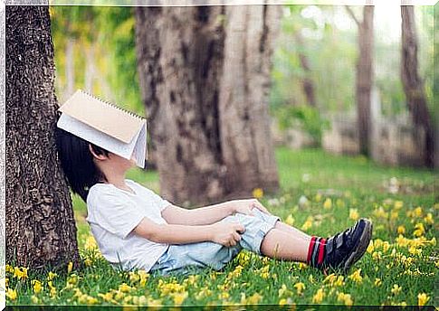 apathetic children: children with a book over their face