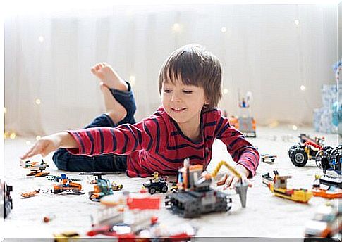 Boy playing with toys.
