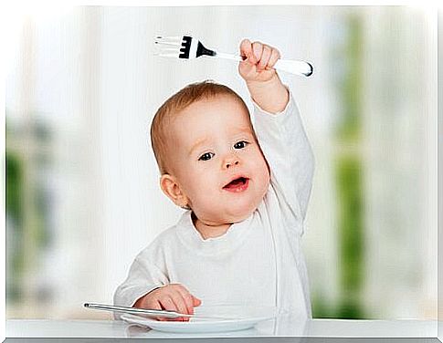 Baby with fork.
