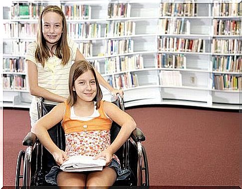 inclusive school: two girls, one in a wheelchair