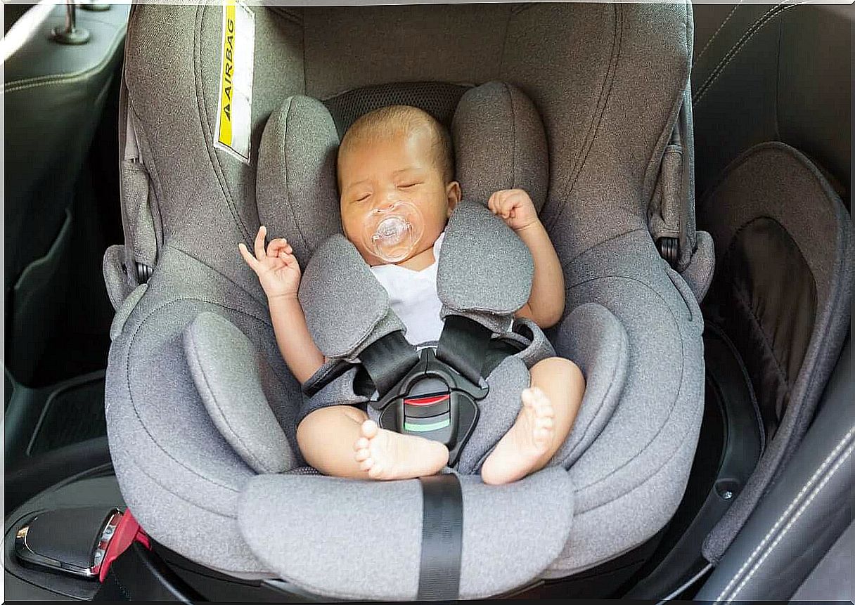 A newborn in a car seat.