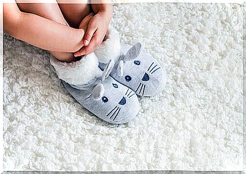 children's feet with rabbit slippers